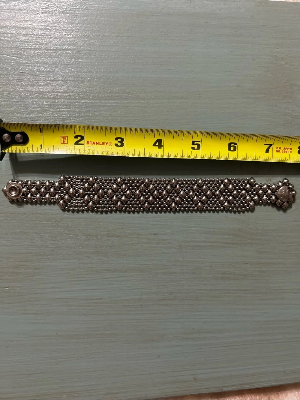 Sergio Gutierrez Liquid Metal Snap Bracelet W/ Matching Dangle Earrings.